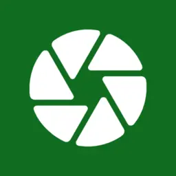 White camera aperture on a green square
